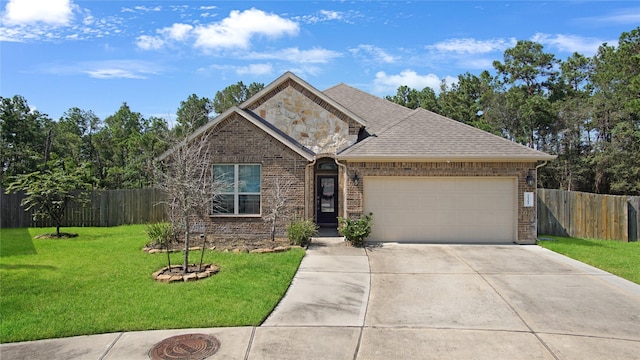 view of front of home featuring a garage and a front yard