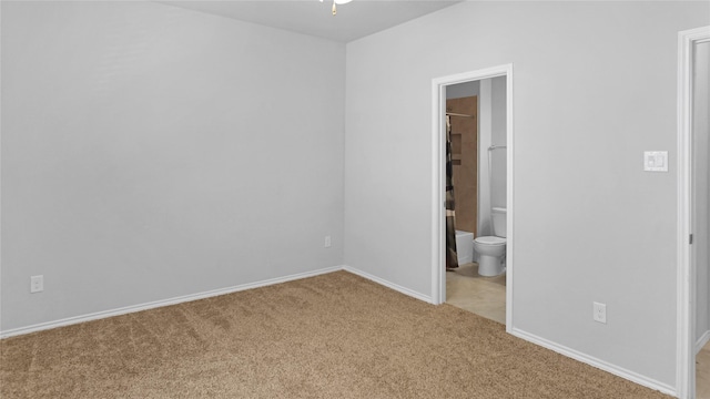 unfurnished room with light colored carpet