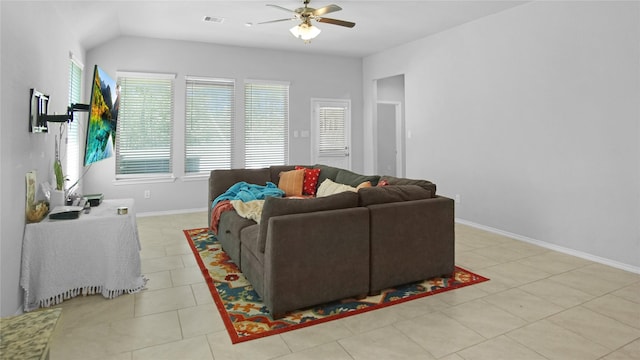 tiled living room featuring ceiling fan