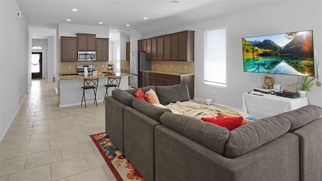 living room with light tile patterned floors