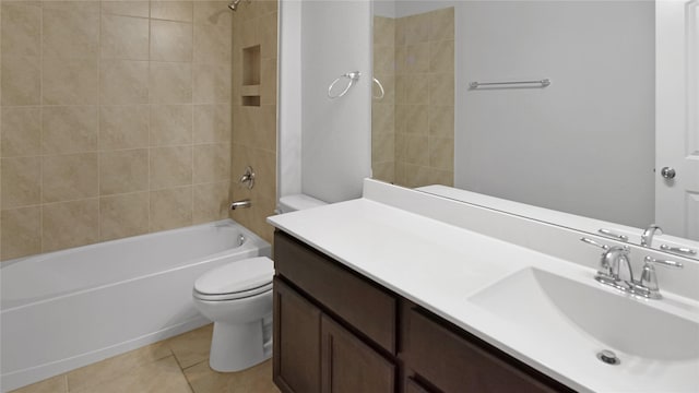 full bathroom featuring vanity, tile patterned floors, tiled shower / bath combo, and toilet