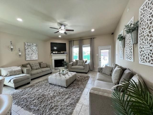 tiled living room with ceiling fan