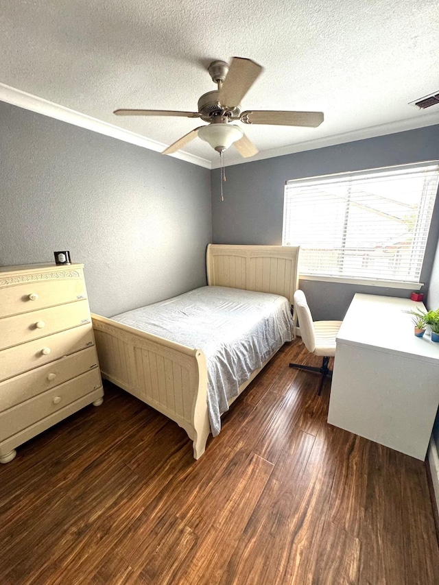 bedroom featuring a textured ceiling, ceiling fan, crown molding, and dark hardwood / wood-style floors