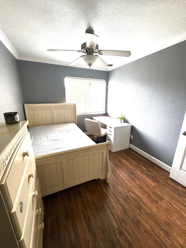 unfurnished bedroom featuring ceiling fan, dark hardwood / wood-style flooring, and a textured ceiling