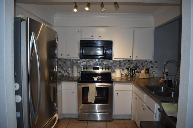 kitchen with decorative backsplash, sink, white cabinets, and stainless steel appliances