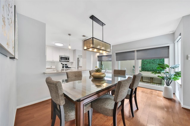 dining room with light hardwood / wood-style flooring