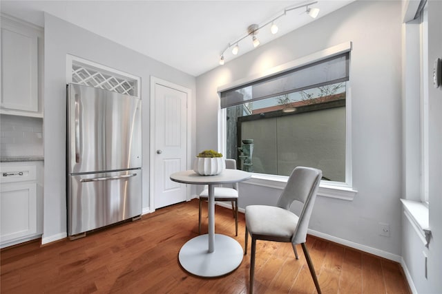 dining room with dark hardwood / wood-style flooring and breakfast area