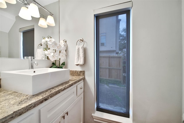 bathroom with vanity and an inviting chandelier