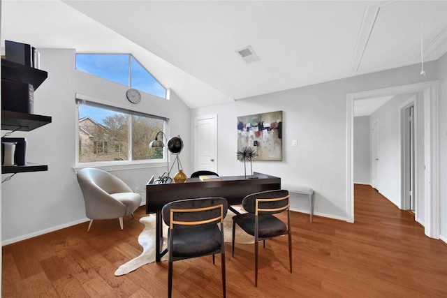 office with hardwood / wood-style flooring and lofted ceiling