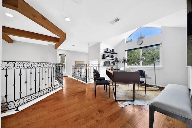 office featuring hardwood / wood-style floors and vaulted ceiling with beams