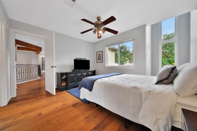 bedroom with ceiling fan and hardwood / wood-style floors