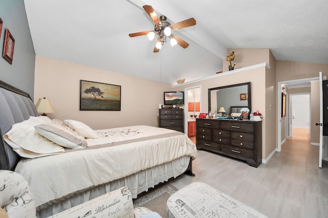 bedroom with ceiling fan, vaulted ceiling with beams, and light hardwood / wood-style flooring