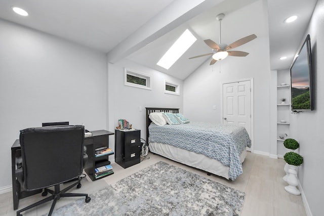 bedroom with ceiling fan, light hardwood / wood-style floors, and lofted ceiling