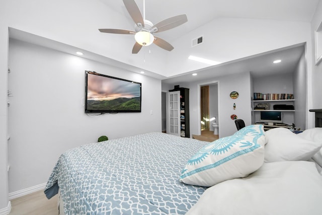 bedroom featuring ceiling fan, light hardwood / wood-style flooring, and lofted ceiling