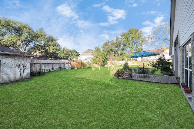 view of yard featuring a wooden deck