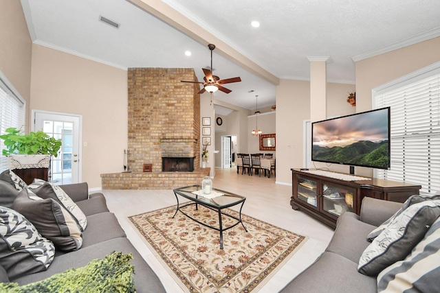 living room with ceiling fan, beam ceiling, a fireplace, and high vaulted ceiling