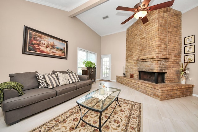 living room with ceiling fan, lofted ceiling with beams, and a brick fireplace