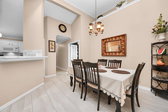 dining space with a chandelier and crown molding