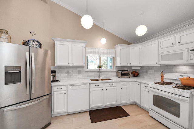 kitchen with pendant lighting, white appliances, white cabinets, and lofted ceiling