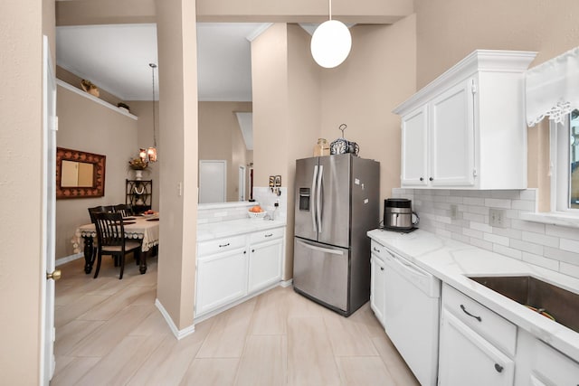 kitchen with backsplash, dishwasher, pendant lighting, stainless steel fridge with ice dispenser, and white cabinets