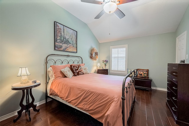 bedroom featuring ceiling fan, dark wood-type flooring, and vaulted ceiling