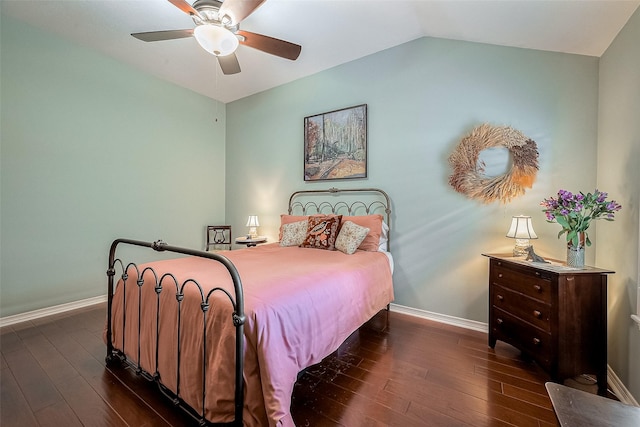 bedroom with ceiling fan, dark hardwood / wood-style floors, and lofted ceiling