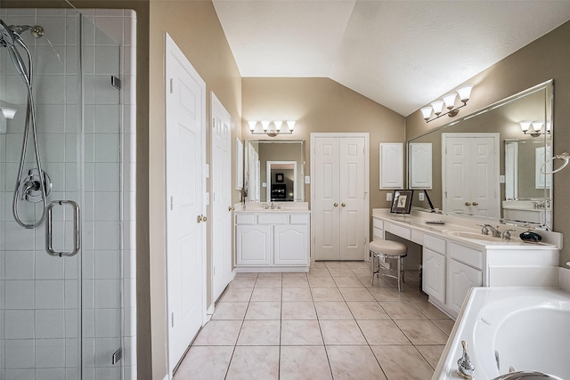 bathroom featuring vanity, vaulted ceiling, an enclosed shower, and tile patterned flooring