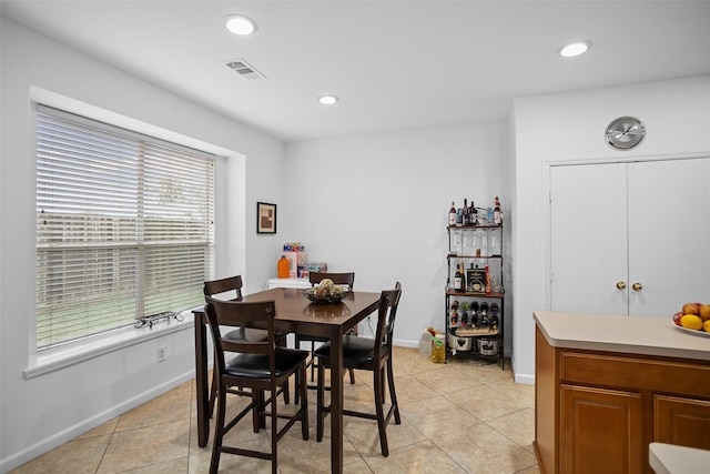 dining area with light tile patterned flooring