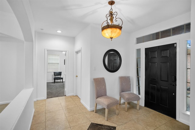 foyer entrance with light tile patterned floors