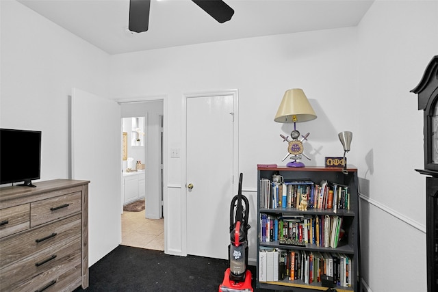 interior space with ceiling fan and tile patterned flooring