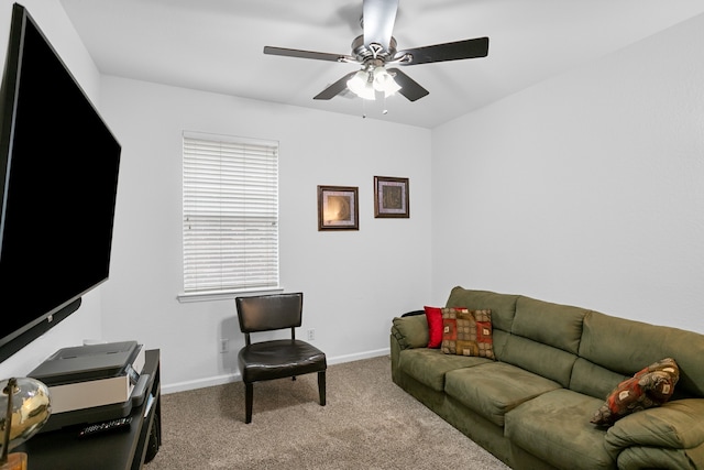 carpeted living room featuring ceiling fan