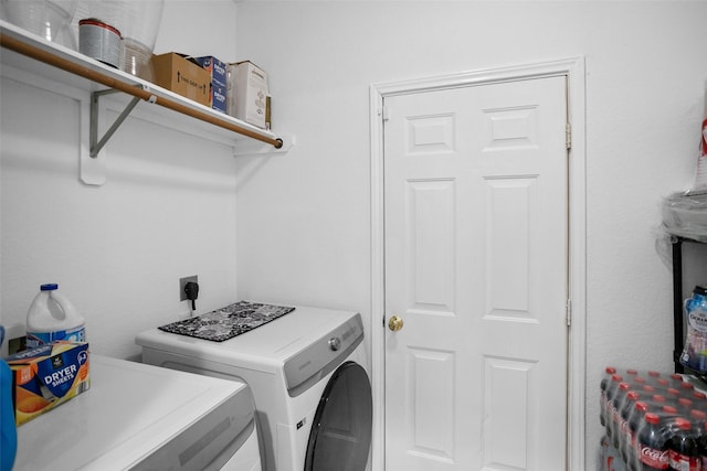 laundry area with washing machine and dryer