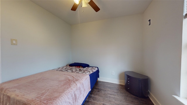 bedroom with vaulted ceiling, ceiling fan, and dark wood-type flooring