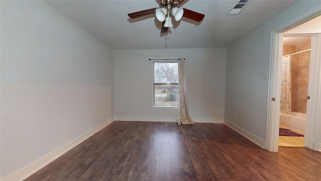 spare room with ceiling fan and dark hardwood / wood-style flooring