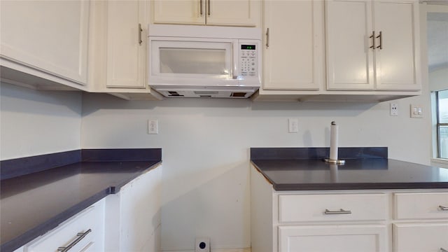 kitchen featuring white cabinetry