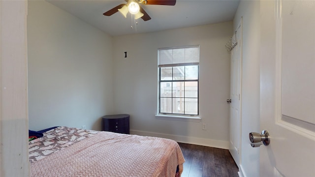 bedroom featuring ceiling fan and dark hardwood / wood-style floors