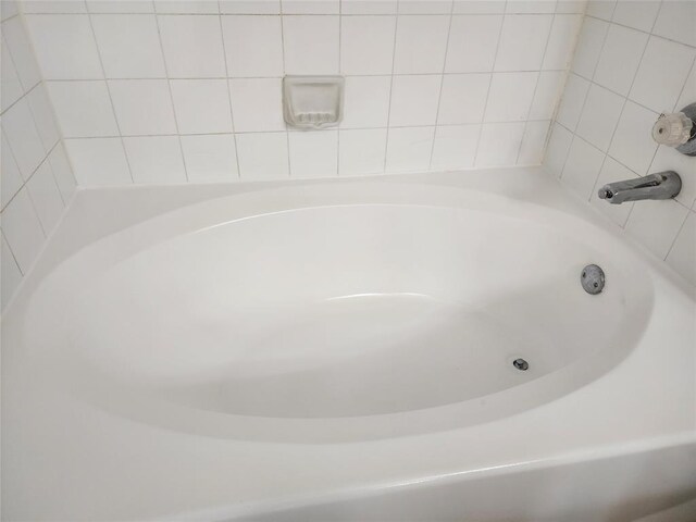 bathroom featuring a tub to relax in