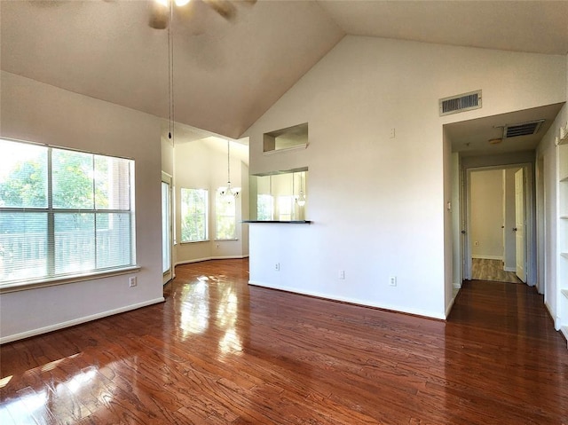 interior space featuring ceiling fan, dark hardwood / wood-style floors, and high vaulted ceiling