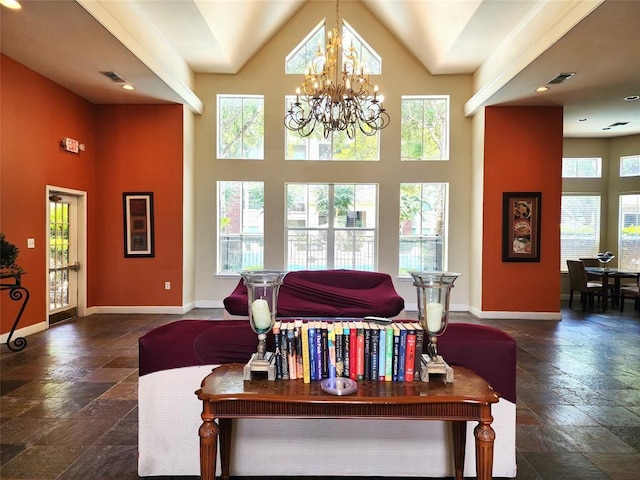 living room featuring a high ceiling and an inviting chandelier