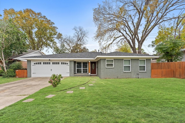 ranch-style home featuring a front lawn and a garage