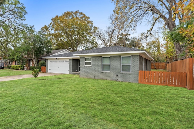 ranch-style home with a garage and a front yard