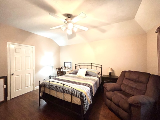 bedroom with vaulted ceiling, ceiling fan, and dark wood-type flooring