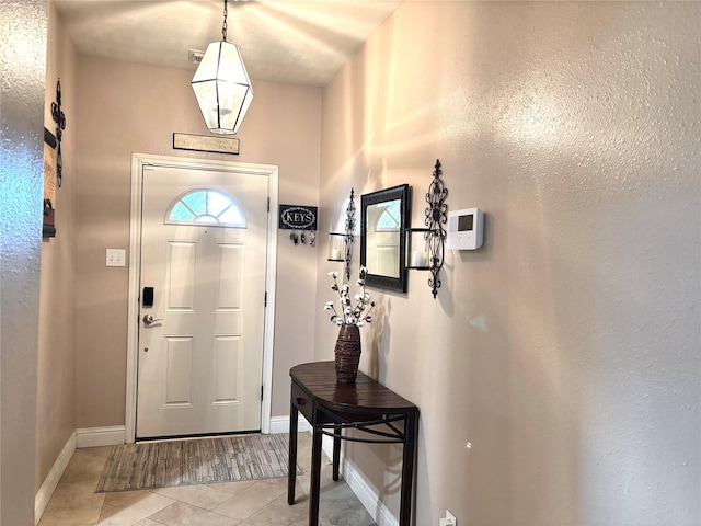 foyer with light tile patterned flooring