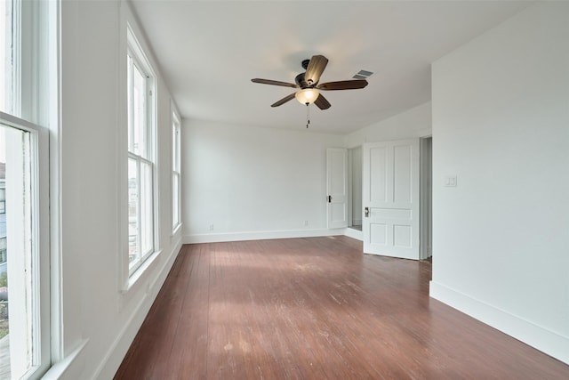 unfurnished room with ceiling fan and dark wood-type flooring