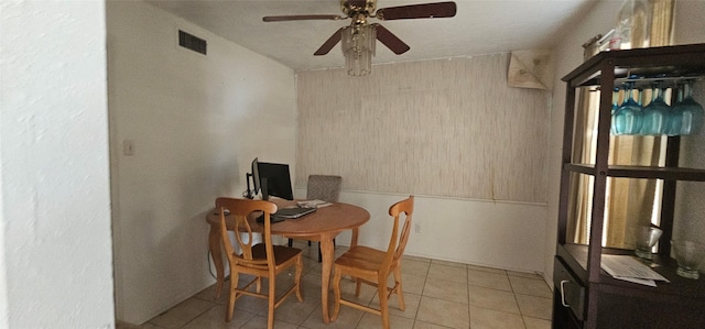 tiled dining room with ceiling fan