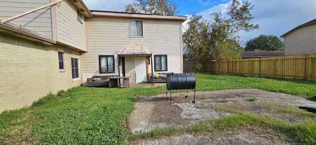 back of house with a yard and cooling unit