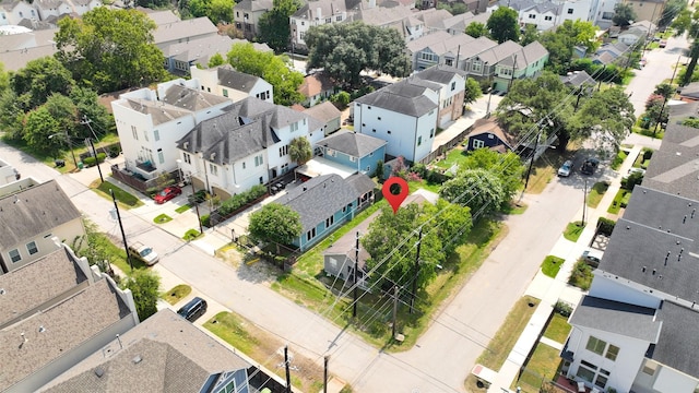 birds eye view of property with a residential view