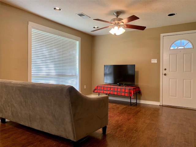 living area featuring visible vents, ceiling fan, baseboards, recessed lighting, and wood finished floors