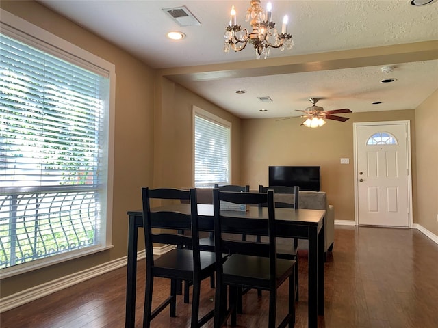 dining room featuring dark wood-style floors, a healthy amount of sunlight, and baseboards