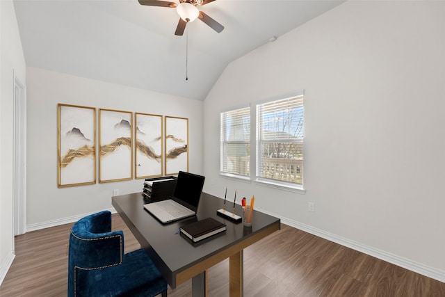 home office with ceiling fan, dark hardwood / wood-style flooring, and vaulted ceiling